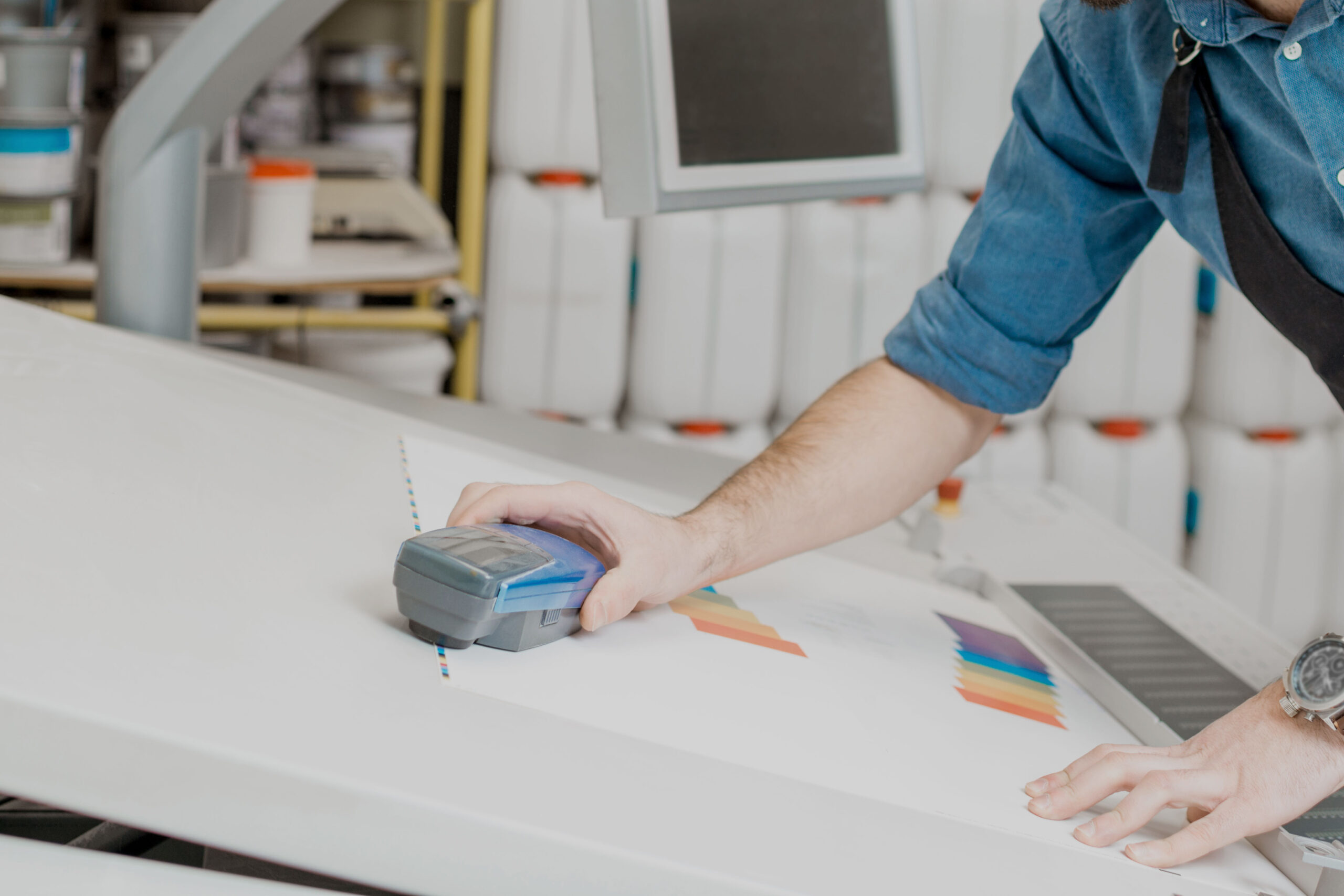 Man working with spectrometer at the manufacturing